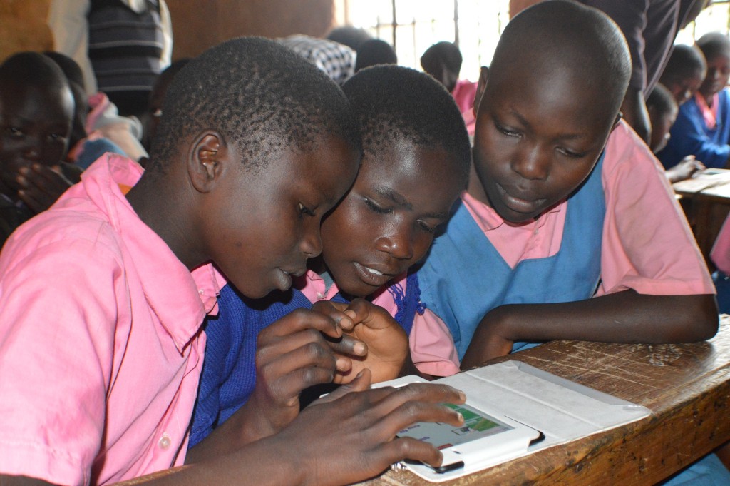 Standard 4 pupils from Wekhonye Primary School using tablets to access educational content from RACHEL. 